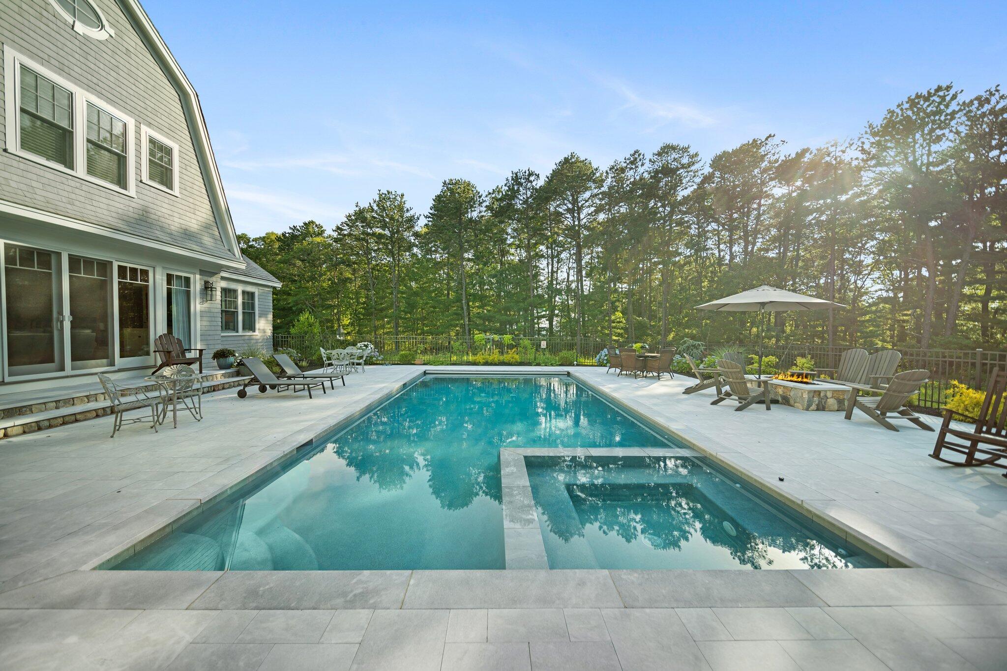 444 Vineyard Road Cotuit, MA 02635 - Photo 41 of 59 a view of a swimming pool with chairs