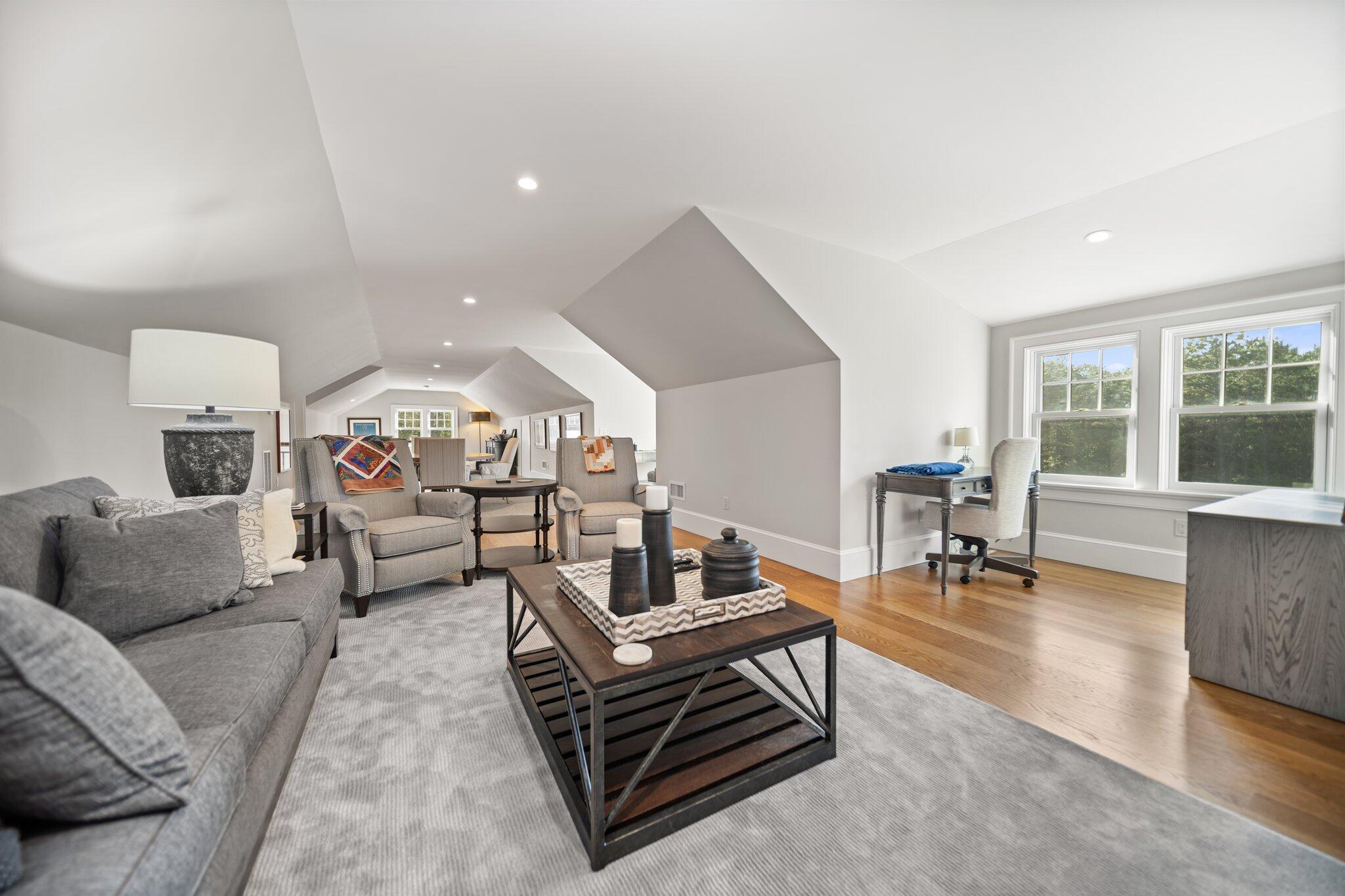 444 Vineyard Road Cotuit, MA 02635 - Photo 49 of 59 a living room with furniture and a table