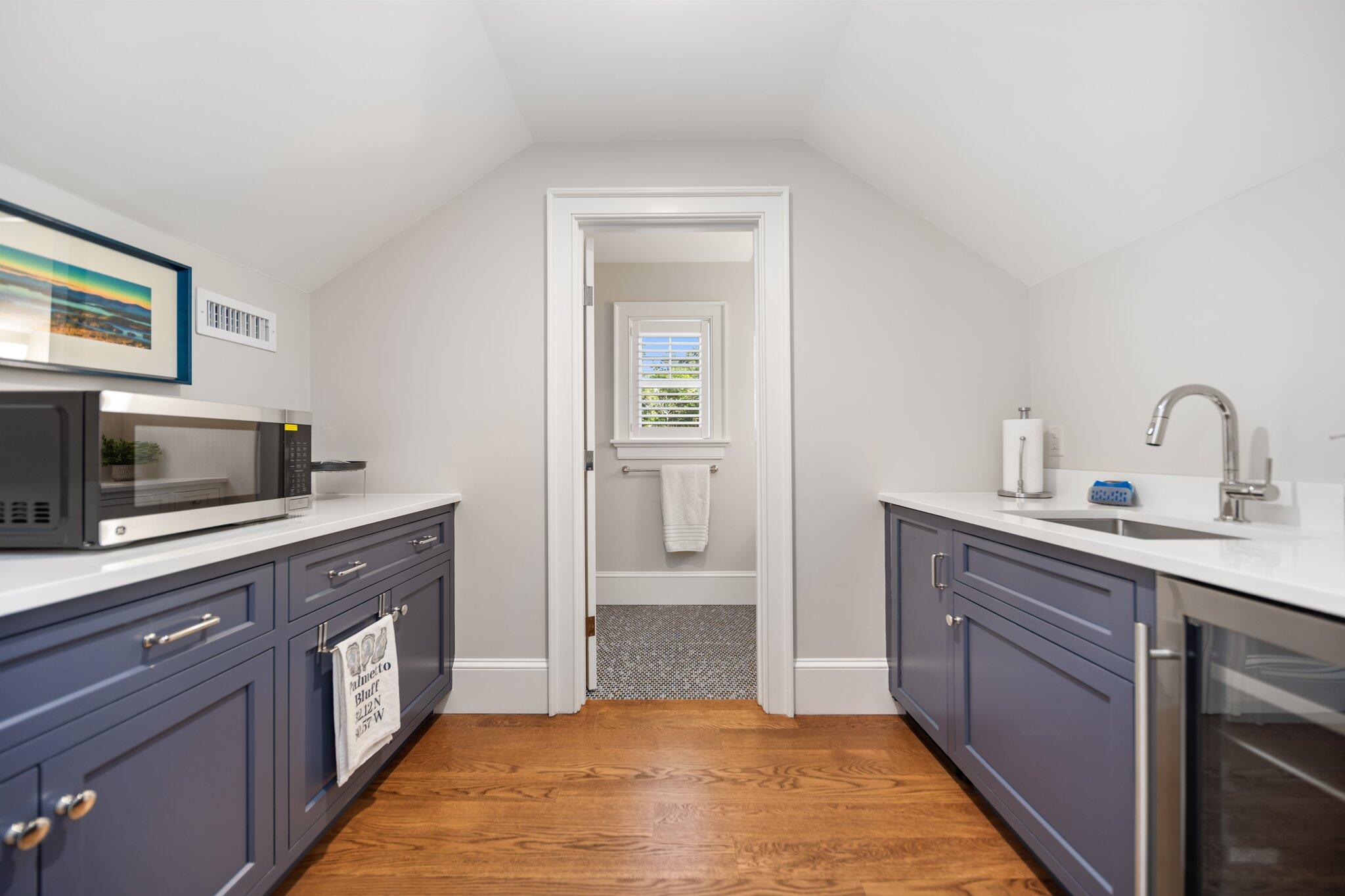 444 Vineyard Road Cotuit, MA 02635 - Photo 50 of 59 a kitchen with a sink and cabinets