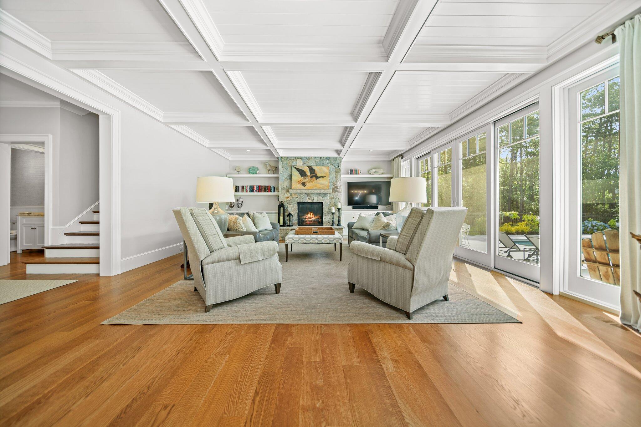 444 Vineyard Road Cotuit, MA 02635 - Photo 6 of 59 a living room with furniture and wooden floor