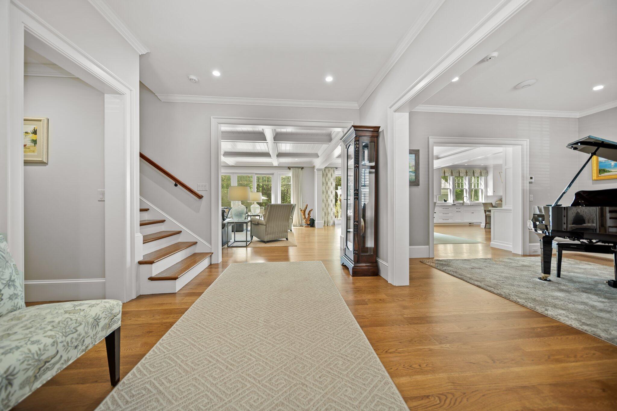 444 Vineyard Road Cotuit, MA 02635 - Photo 10 of 59 a hallway with wooden floor and furniture