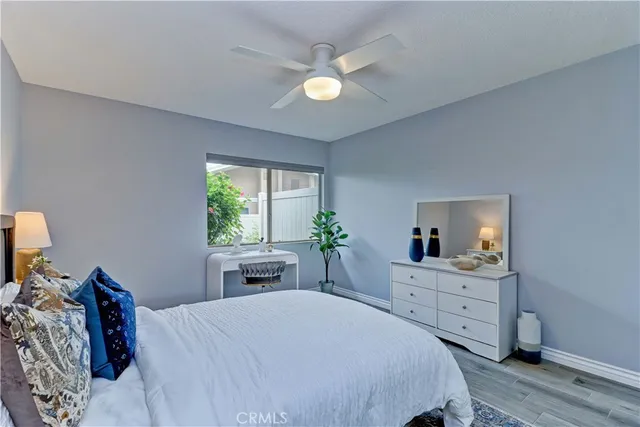a bedroom with a bed and a view of kitchen