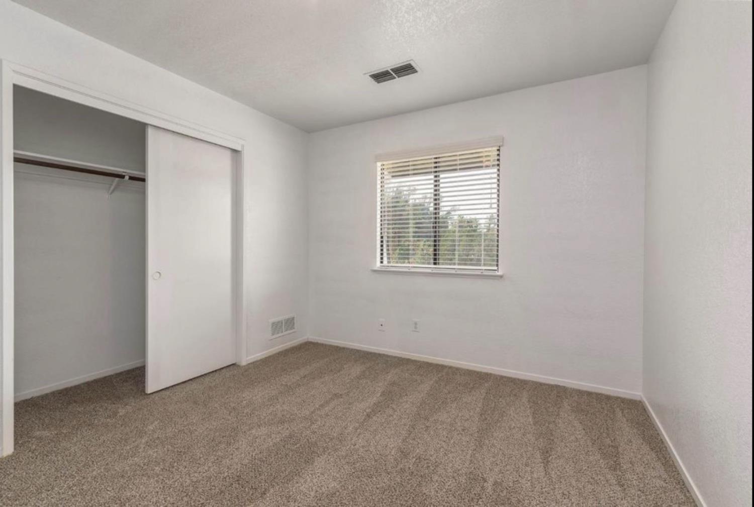 27817 Sky Harbour Road Friant, CA 93626 - Photo 15 of 36 an empty room with a window