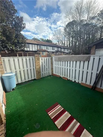 a backyard of a house with lots of green space