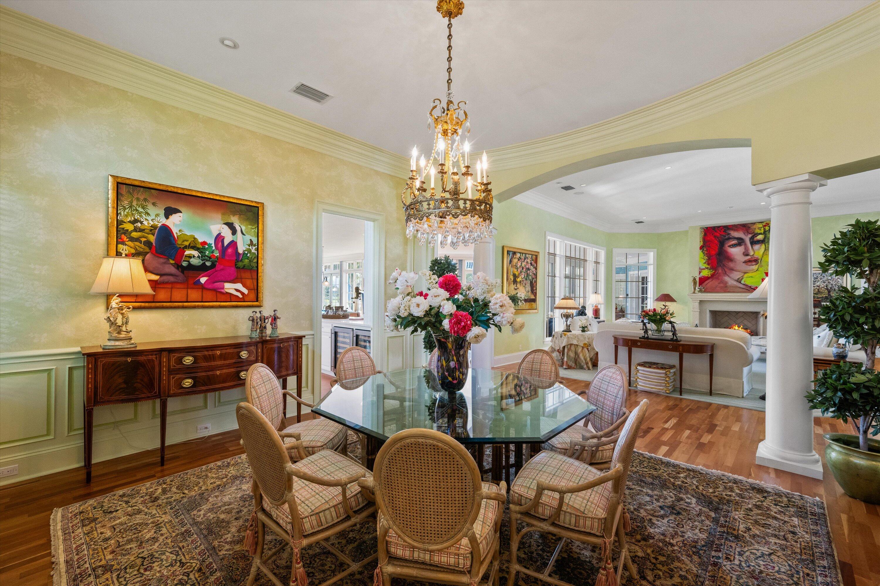 258 Locha Drive Jupiter, FL 33458 - Photo 12 of 76 a dining room with furniture a rug and a chandelier