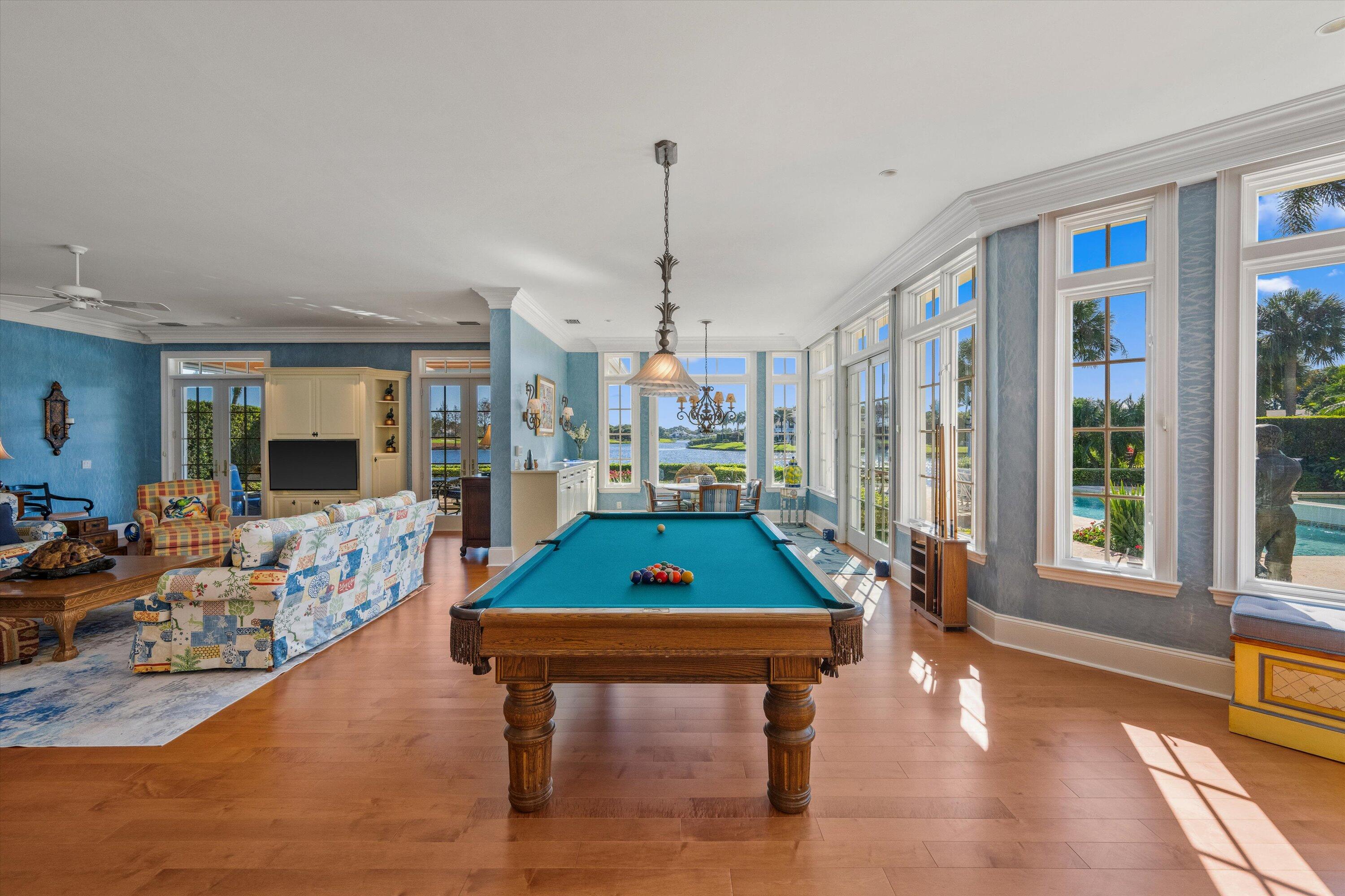 258 Locha Drive Jupiter, FL 33458 - Photo 16 of 76 a living room with furniture a pool table and a large window