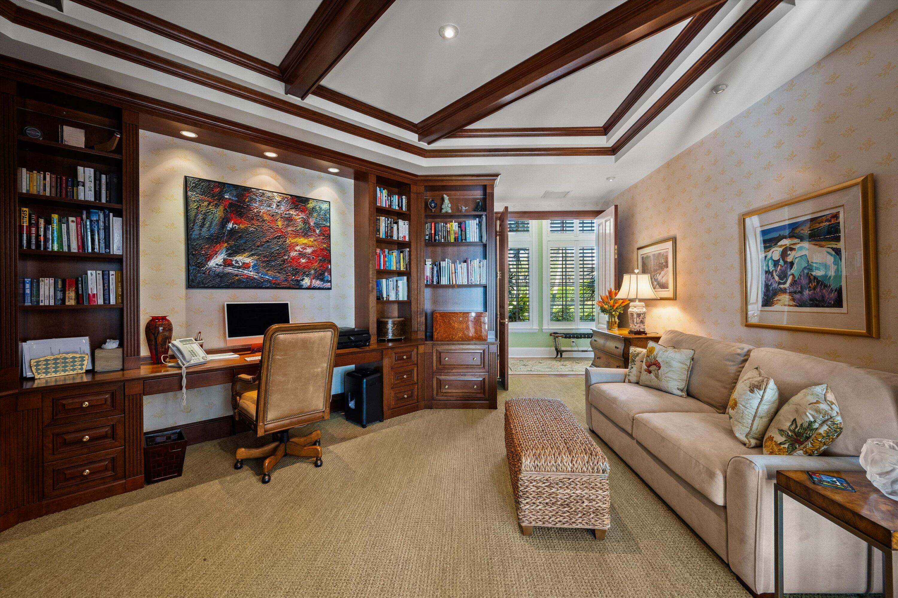 258 Locha Drive Jupiter, FL 33458 - Photo 28 of 76 a living room with furniture a piano and a bookshelf