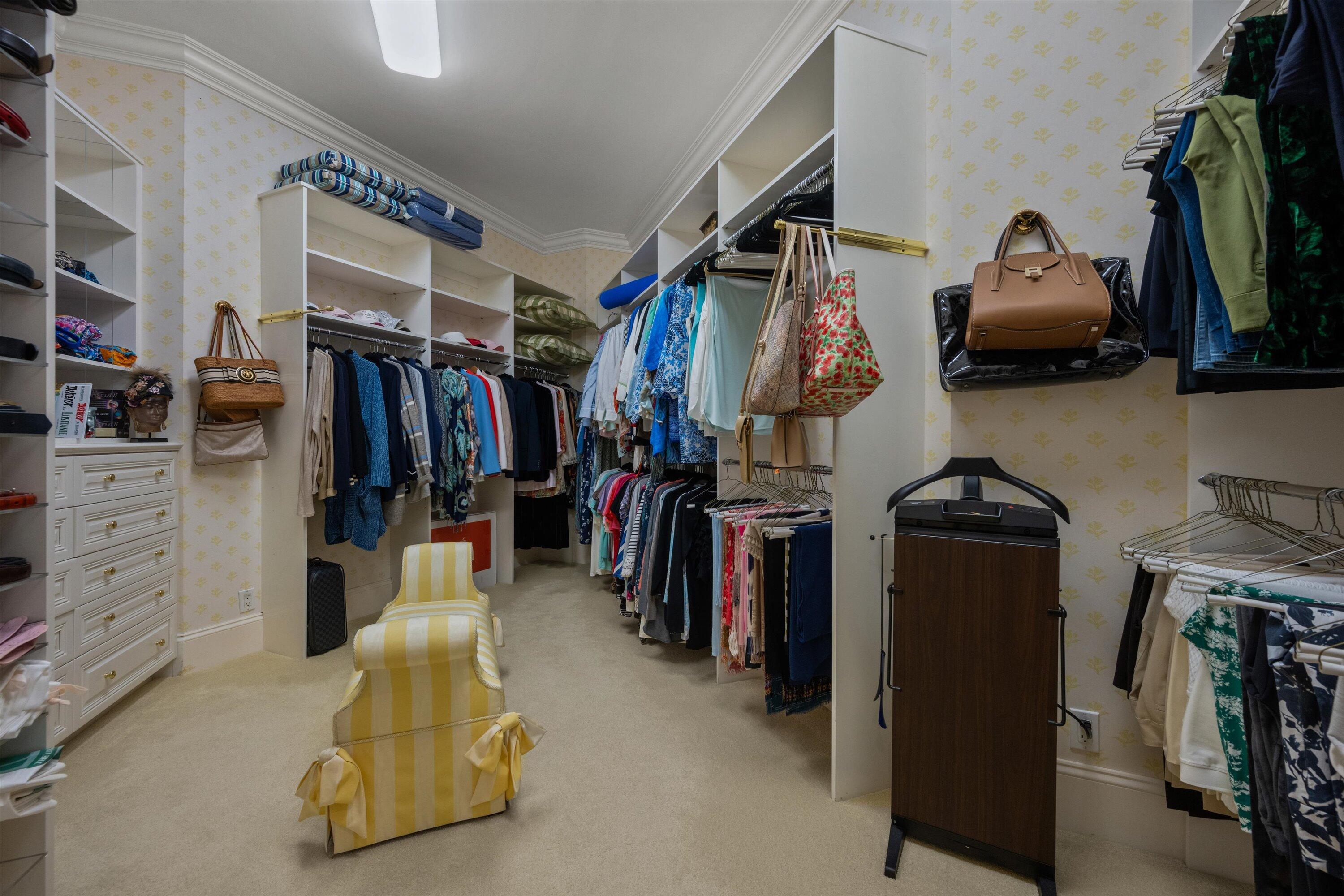 258 Locha Drive Jupiter, FL 33458 - Photo 34 of 76 a walk in closet with clothes and shoes