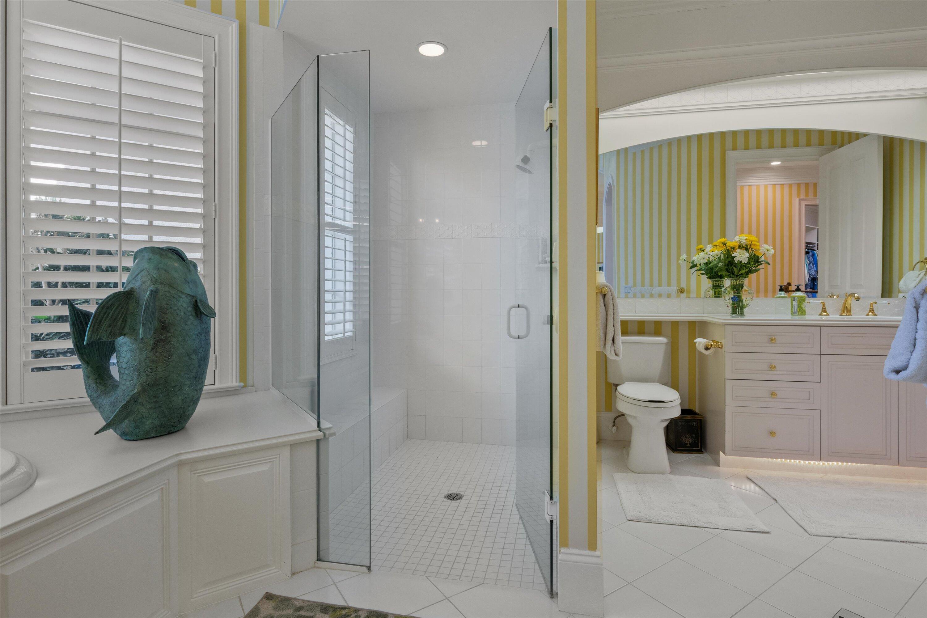 258 Locha Drive Jupiter, FL 33458 - Photo 38 of 76 a bathroom with a sink and mirror