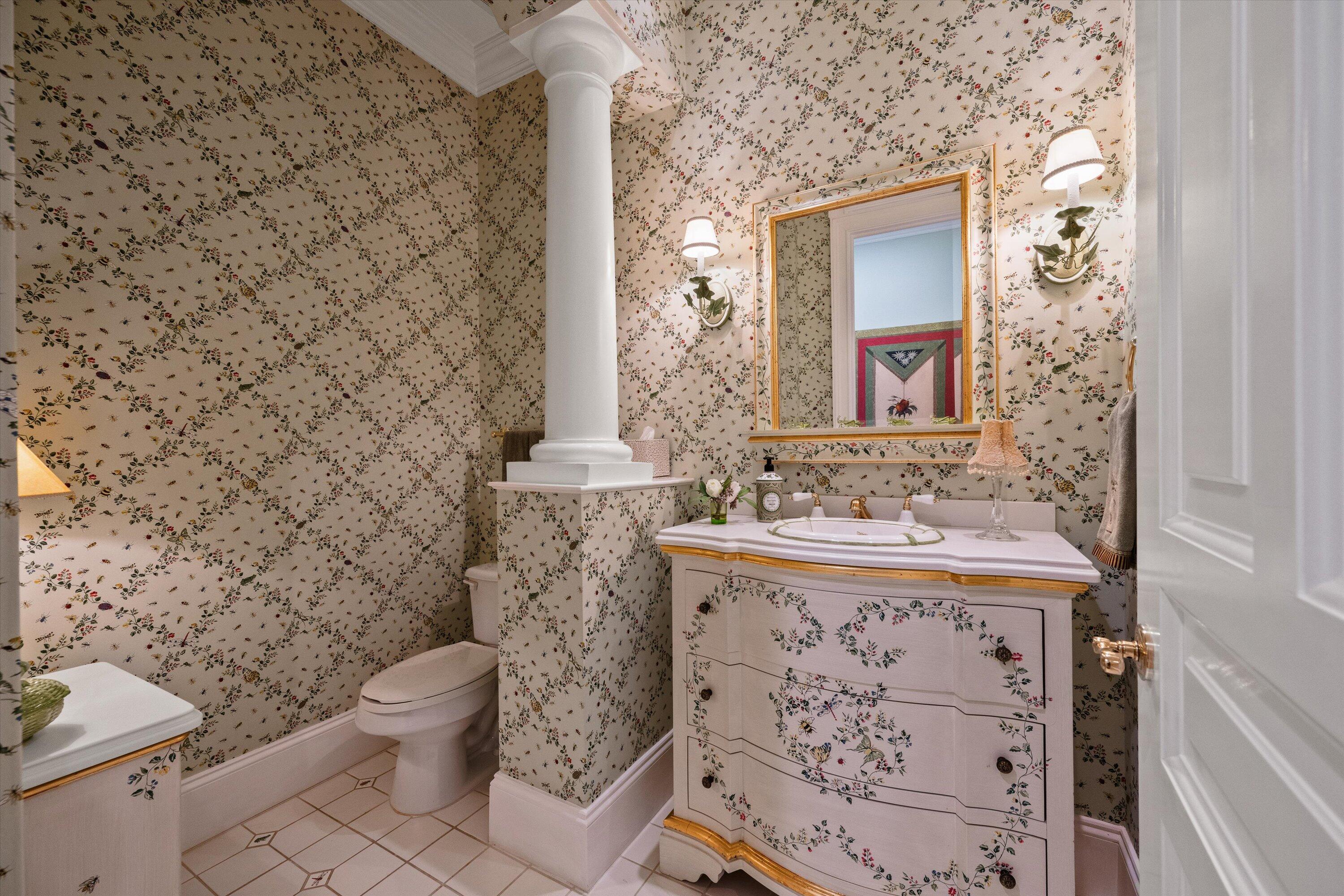 258 Locha Drive Jupiter, FL 33458 - Photo 41 of 76 a bathroom with a granite countertop toilet sink and mirror