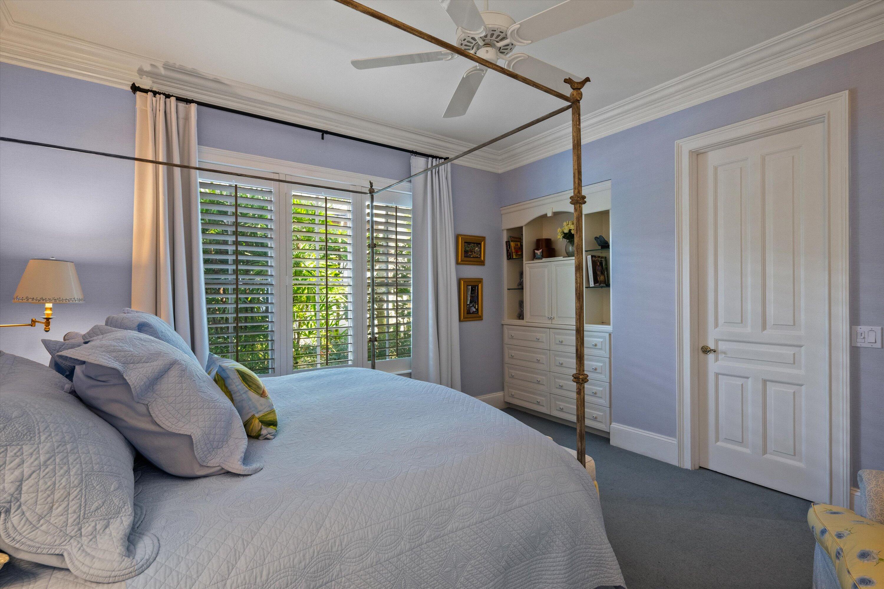 258 Locha Drive Jupiter, FL 33458 - Photo 49 of 76 a bedroom with a bed and a window