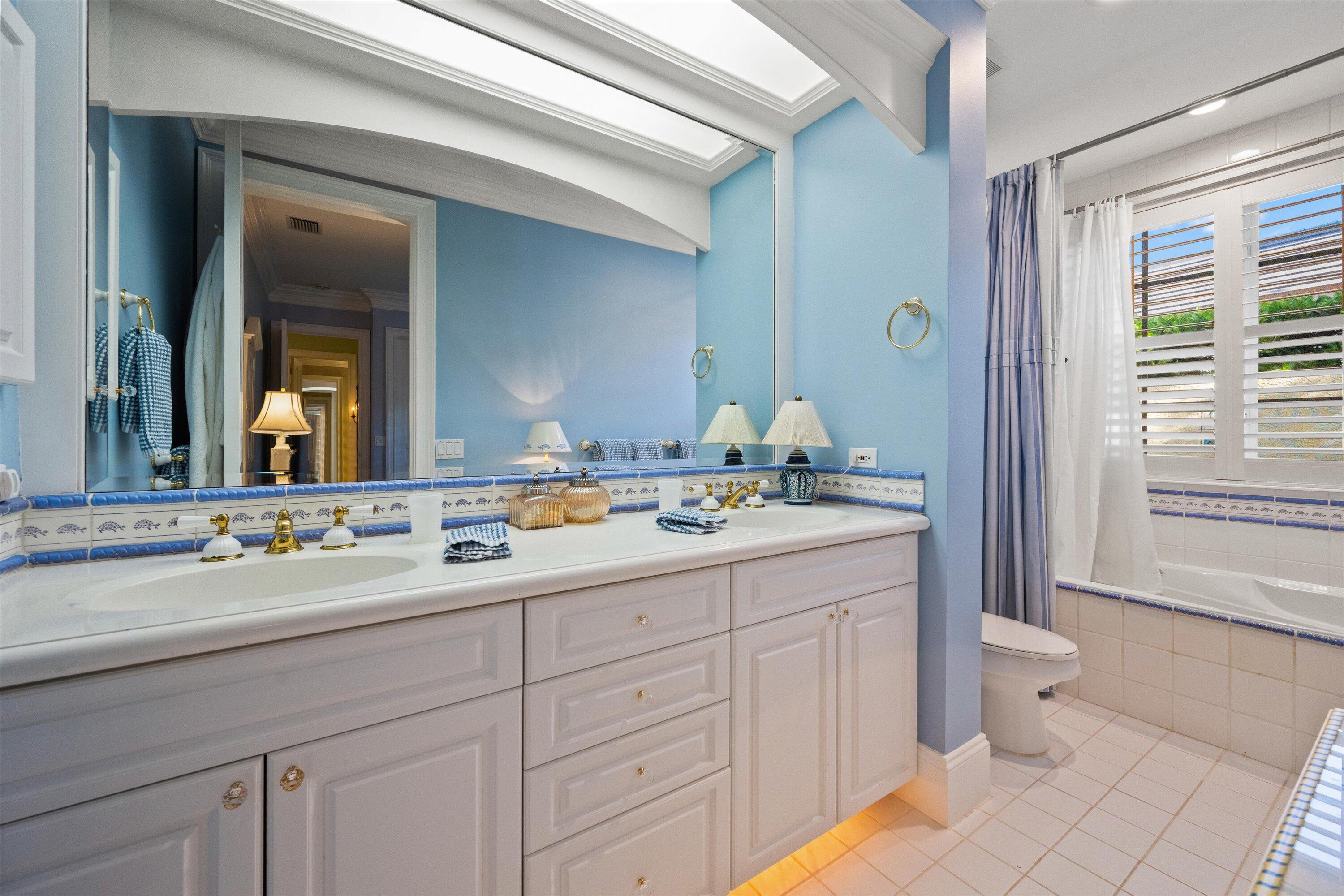 258 Locha Drive Jupiter, FL 33458 - Photo 50 of 76 a bathroom with a sink and a mirror