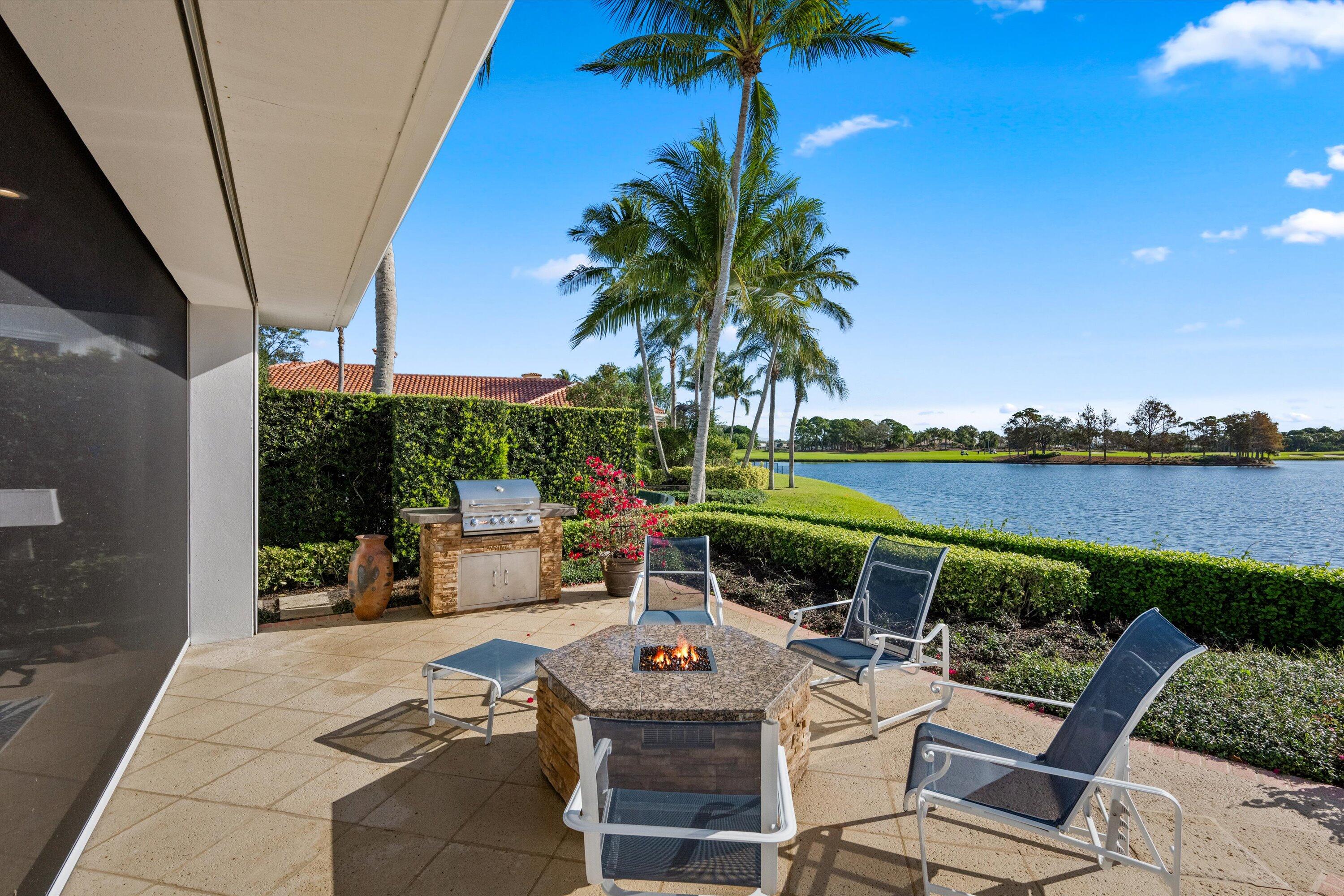 258 Locha Drive Jupiter, FL 33458 - Photo 57 of 76 a view of swimming pool with outdoor seating and yard