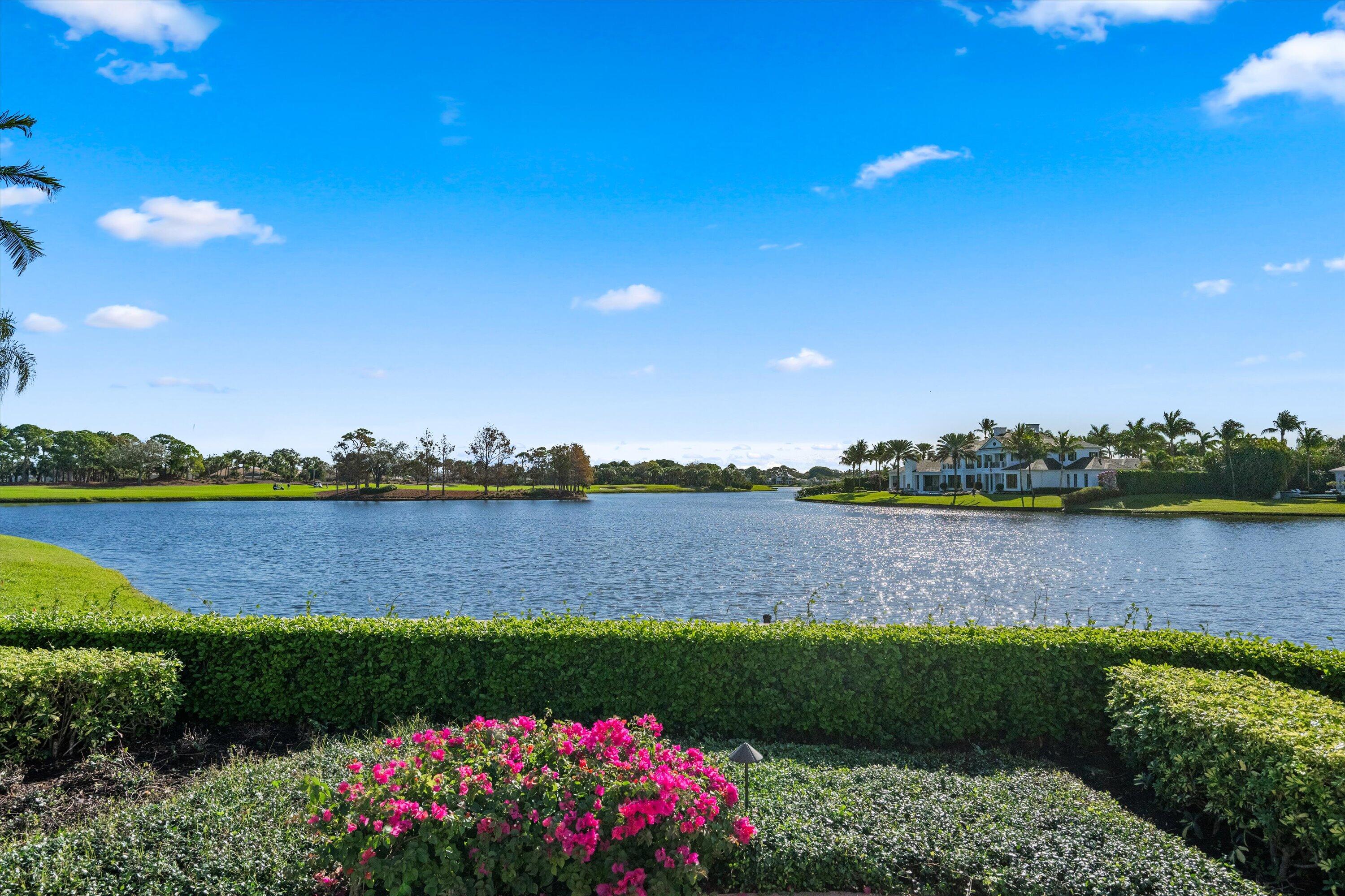 258 Locha Drive Jupiter, FL 33458 - Photo 65 of 76 a view of lake and houses with outdoor space