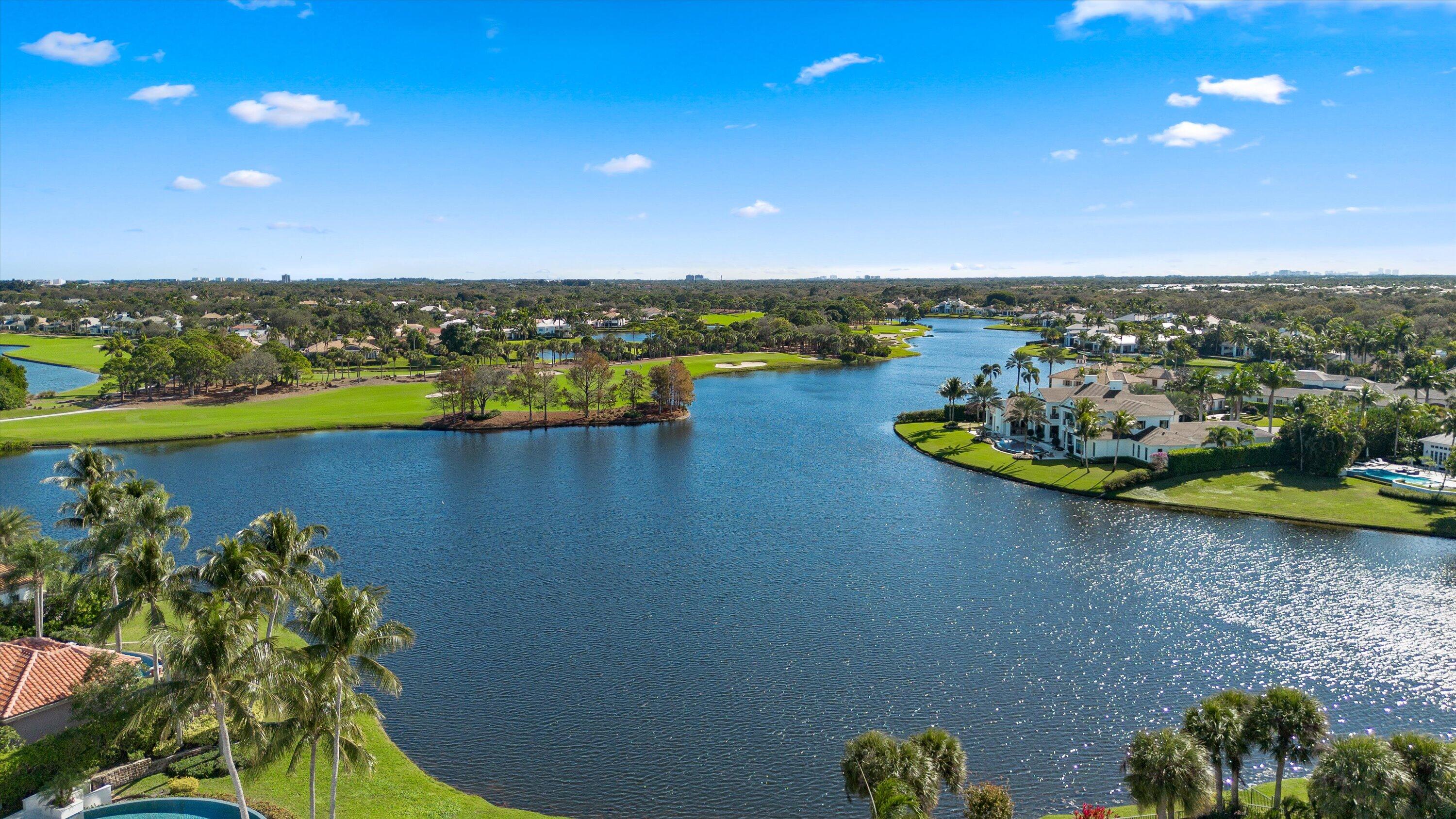 258 Locha Drive Jupiter, FL 33458 - Photo 68 of 76 a view of a lake with a mountain