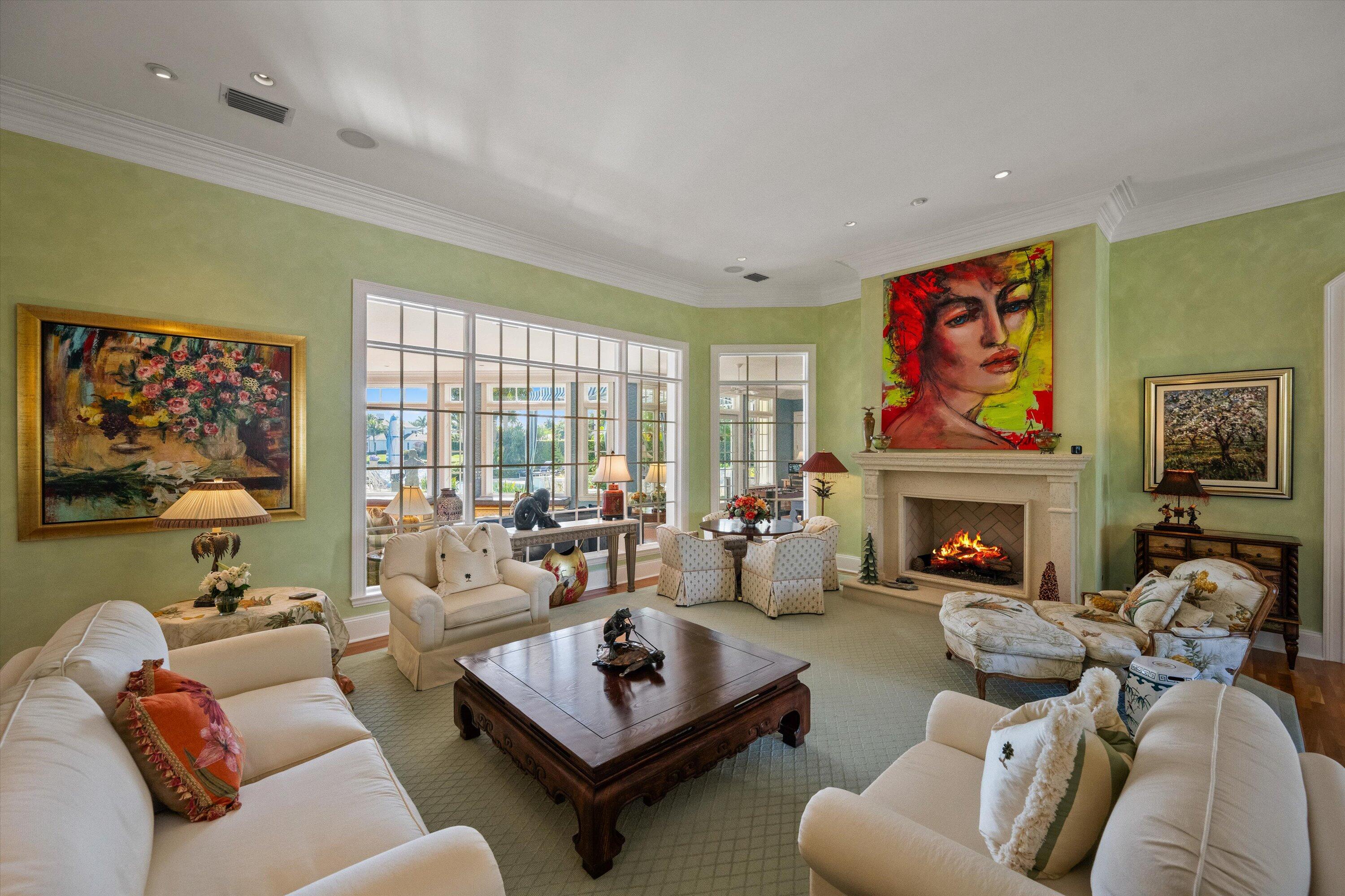 258 Locha Drive Jupiter, FL 33458 - Photo 8 of 76 a living room with furniture fireplace and a large window