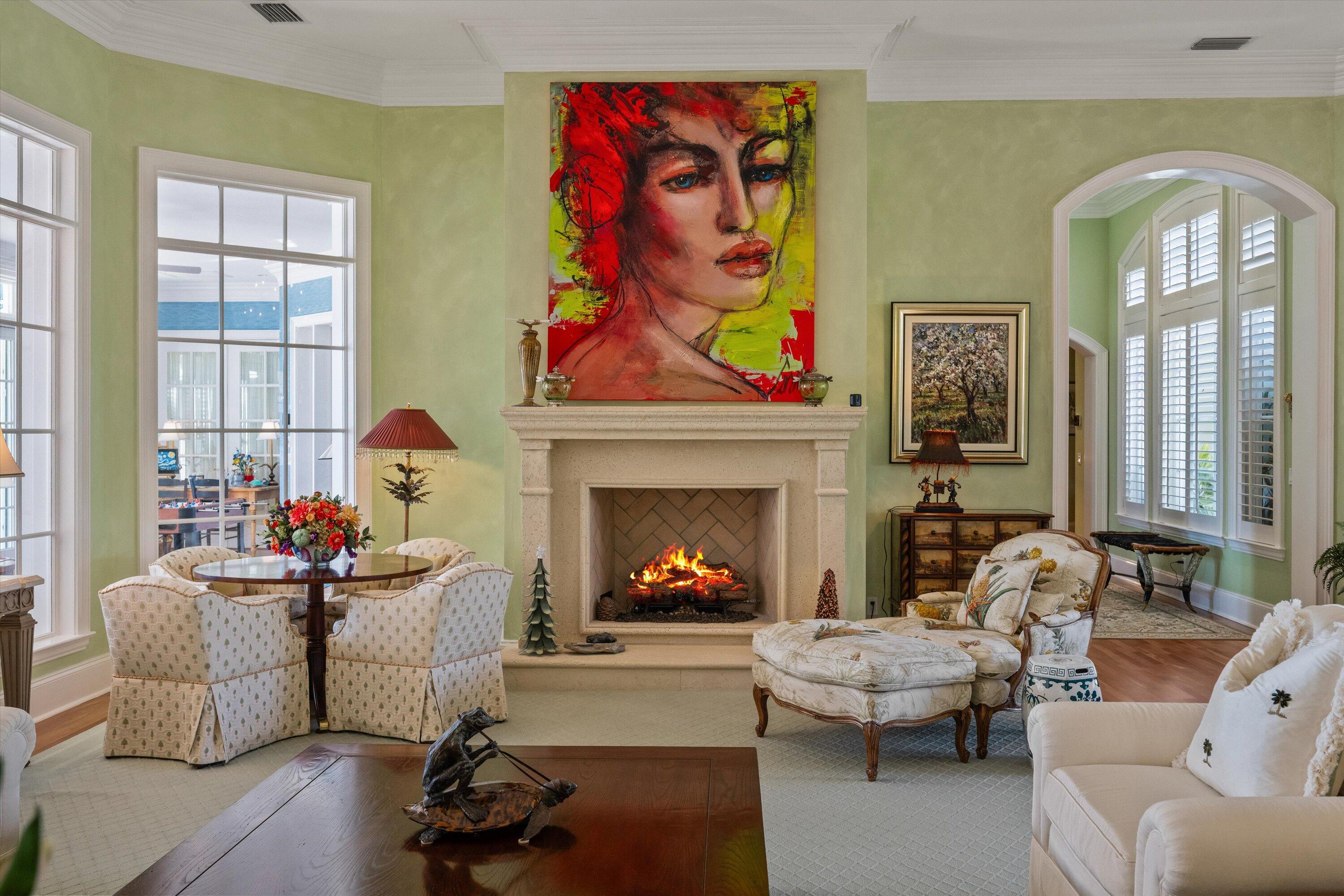 258 Locha Drive Jupiter, FL 33458 - Photo 9 of 76 a living room with furniture potted plant fireplace and a window