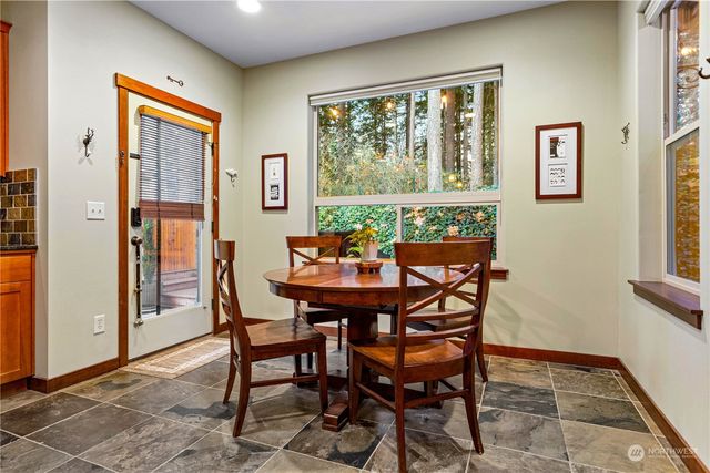 a view of a dining room with furniture window and outside view