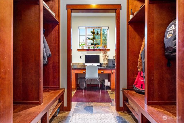 a view of living room with furniture and wooden floor