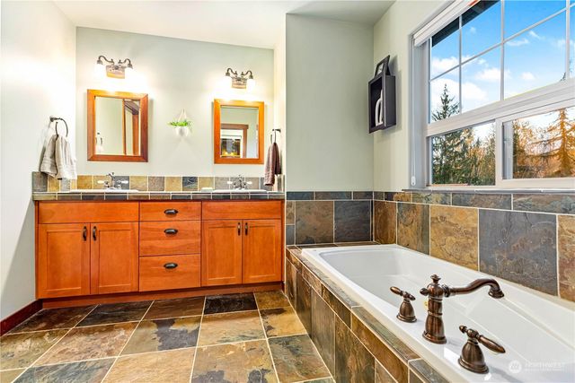 a bathroom with a shower and a sink