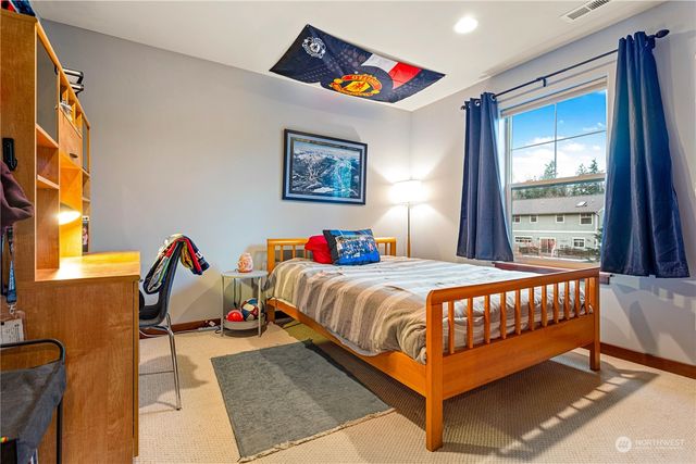 a bedroom with a bed and walk in closet