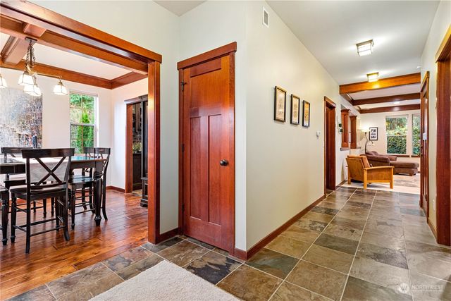 a view of a dining room with furniture window and outside view