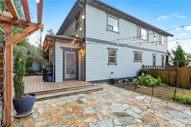 a backyard of a house with outdoor seating