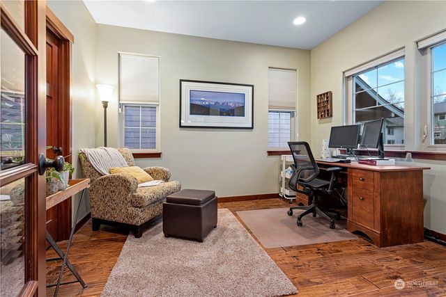 a bedroom with furniture and a window