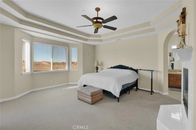 a large bathroom with a double vanity sink a mirror and a bathtub