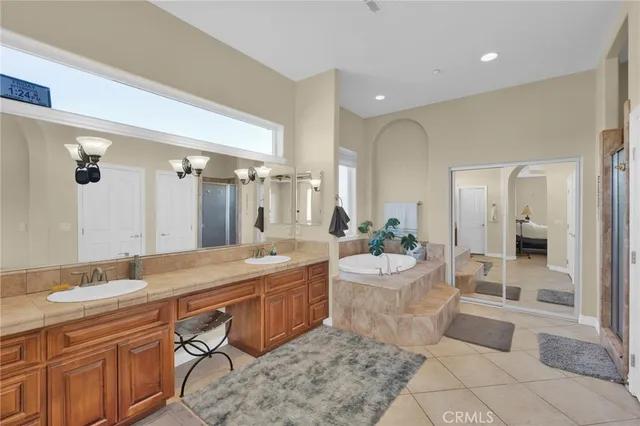 a view of walk in closet with clothes