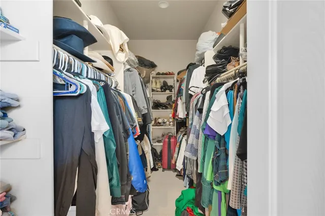 a bedroom with a bed and flat screen tv