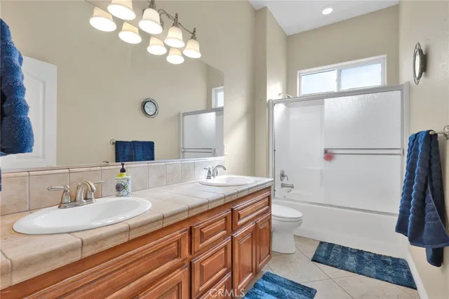 a view of an empty room with a window and stairs