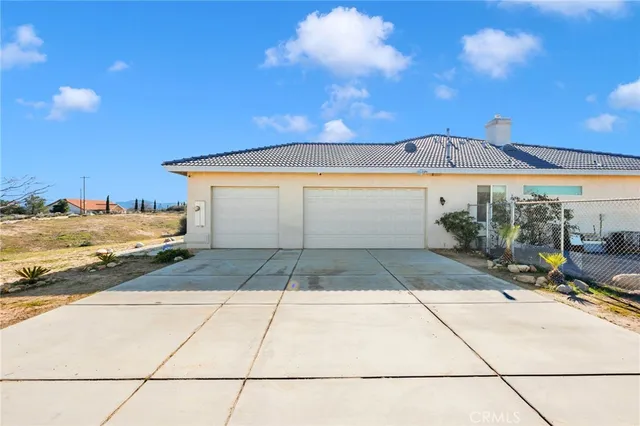 a view of a livingroom with furniture and window