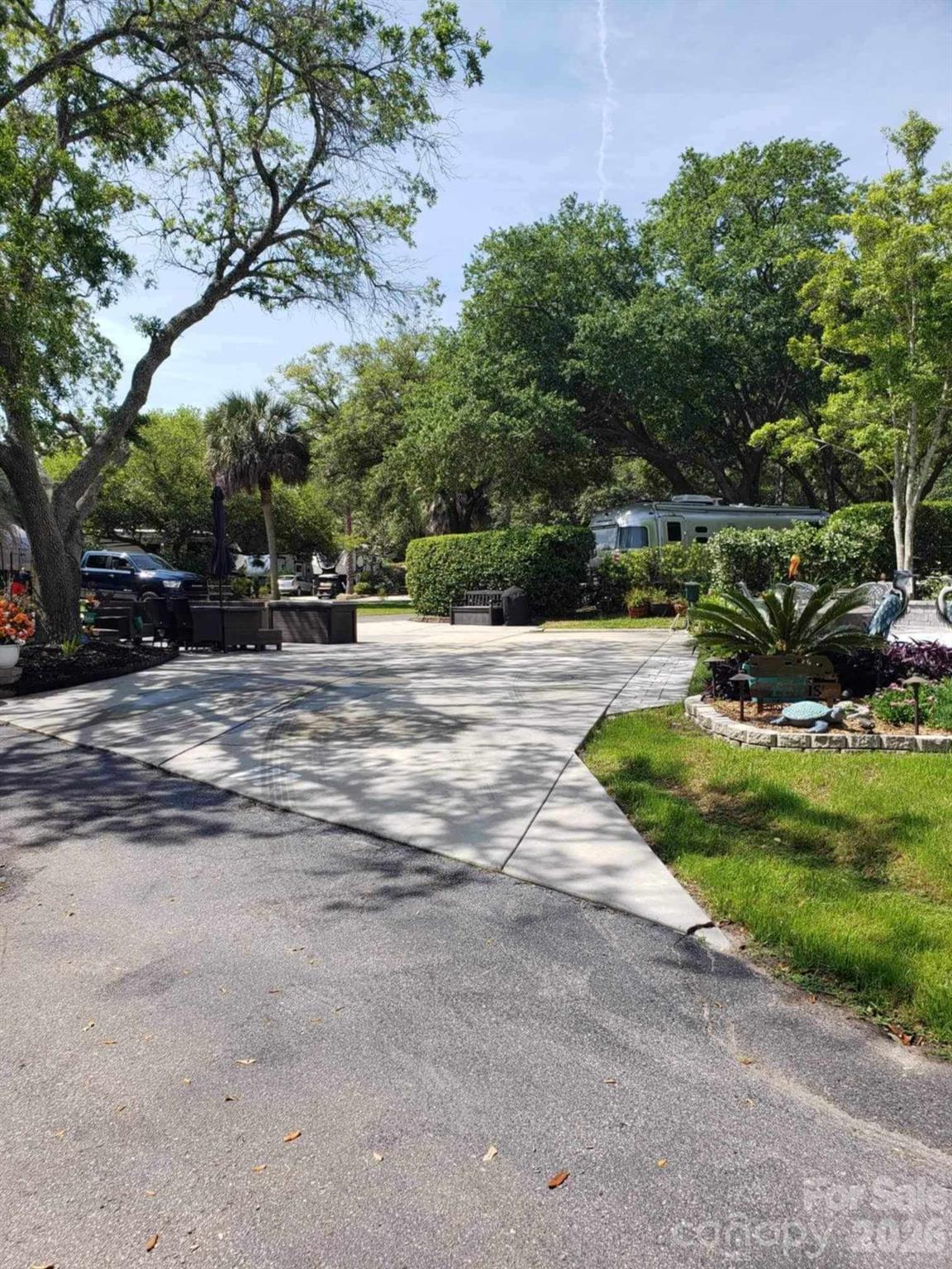 43B Jenkins Island Road, Unit 177 Hilton Head Island, SC 29926 - Photo 2 of 18 a view of a house with a yard
