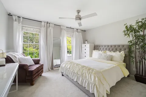 a spacious bedroom with a bed and a couch