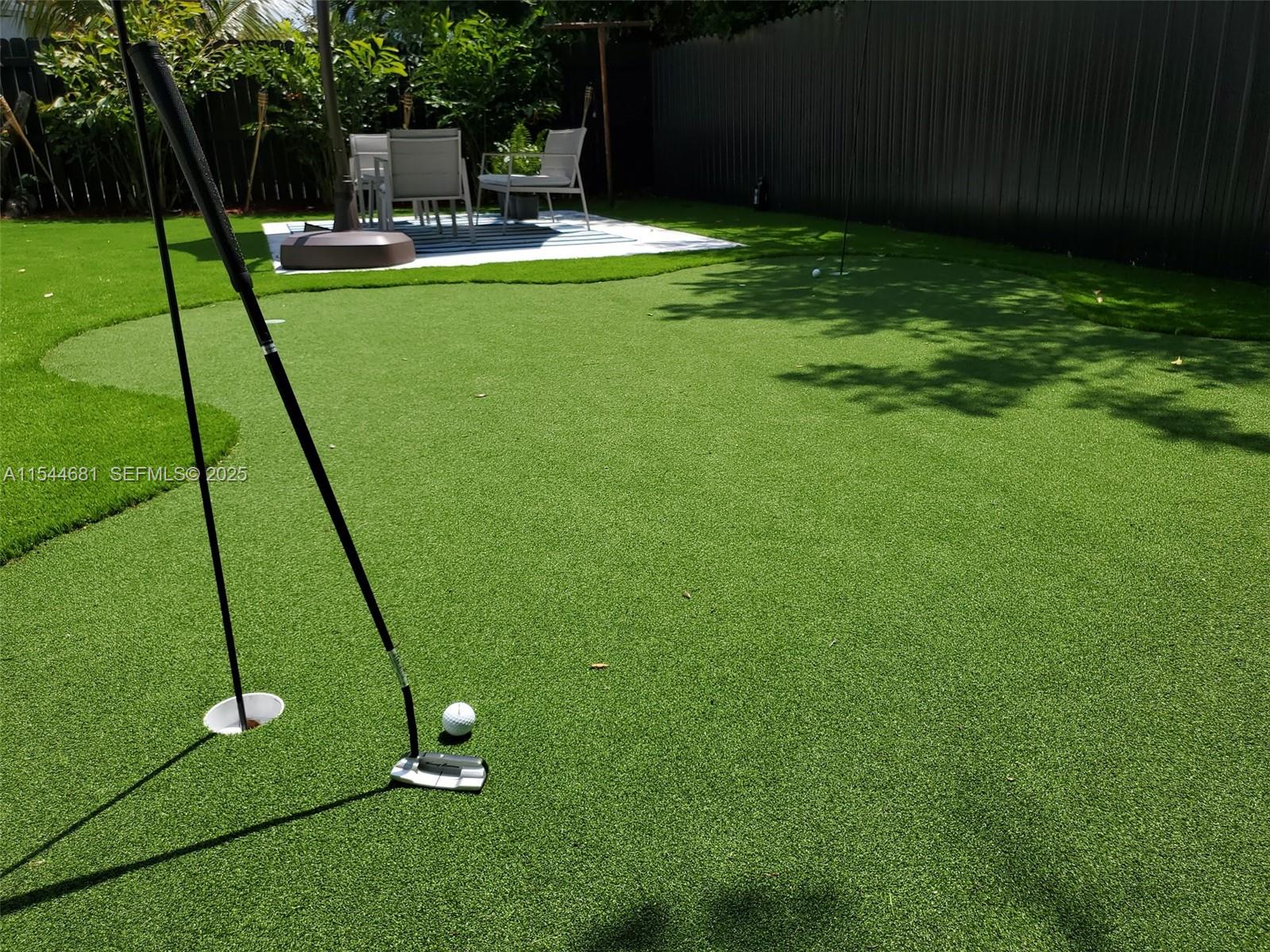 740 Southwest 9th Street, Unit 1 Miami, FL 33130 - Photo 26 of 34 a view of a backyard with a slide