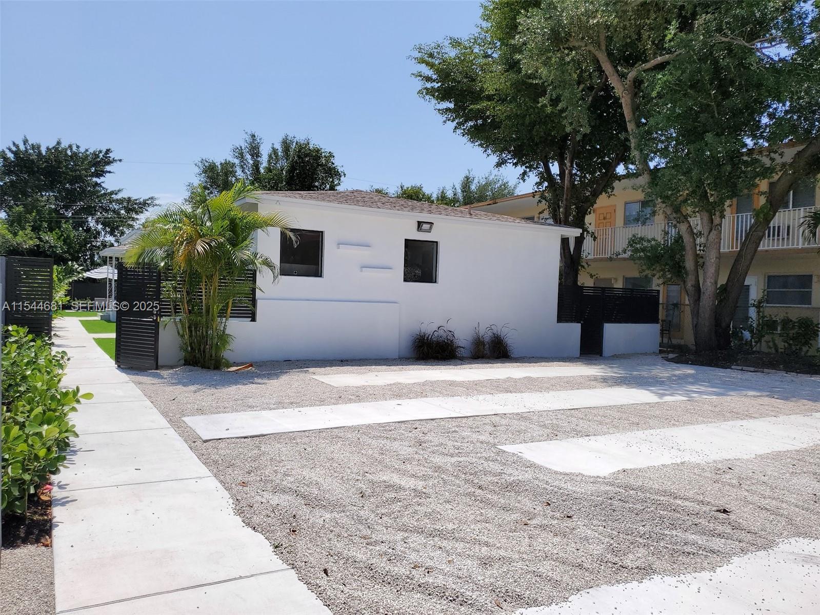 740 Southwest 9th Street, Unit 1 Miami, FL 33130 - Photo 28 of 34 a view of a house with a yard