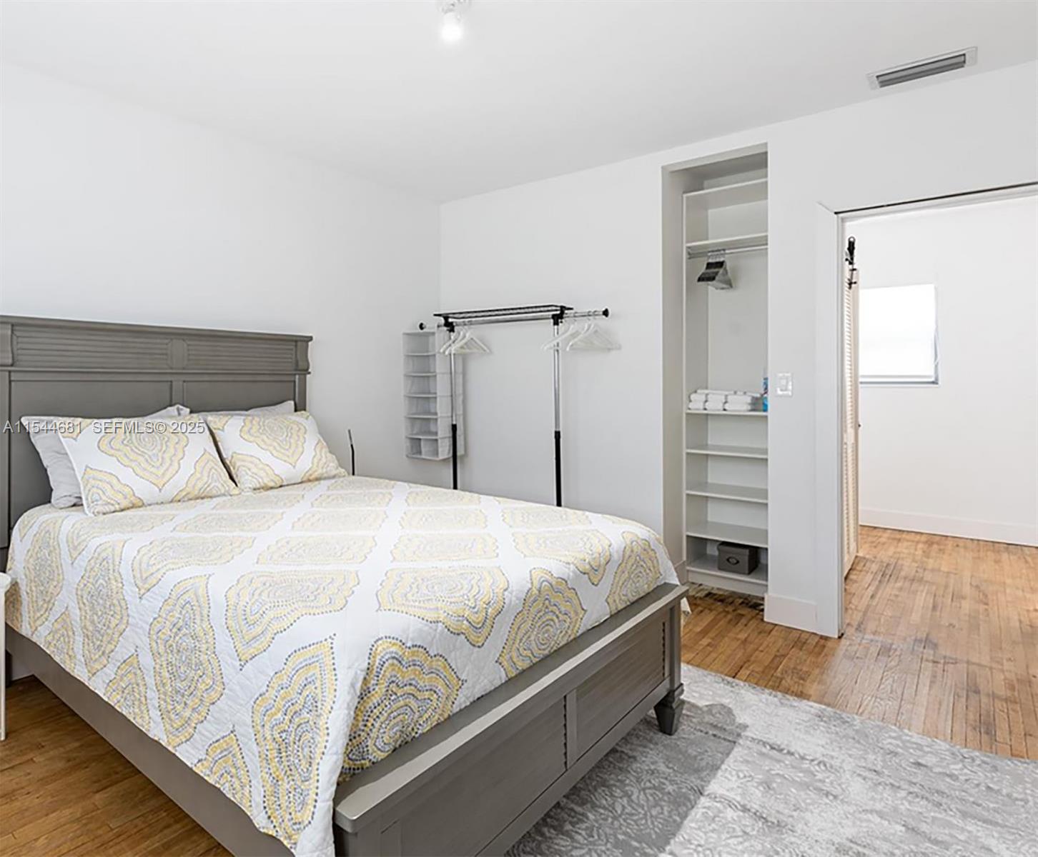 740 Southwest 9th Street, Unit 1 Miami, FL 33130 - Photo 7 of 34 a bedroom with a bed and a dresser