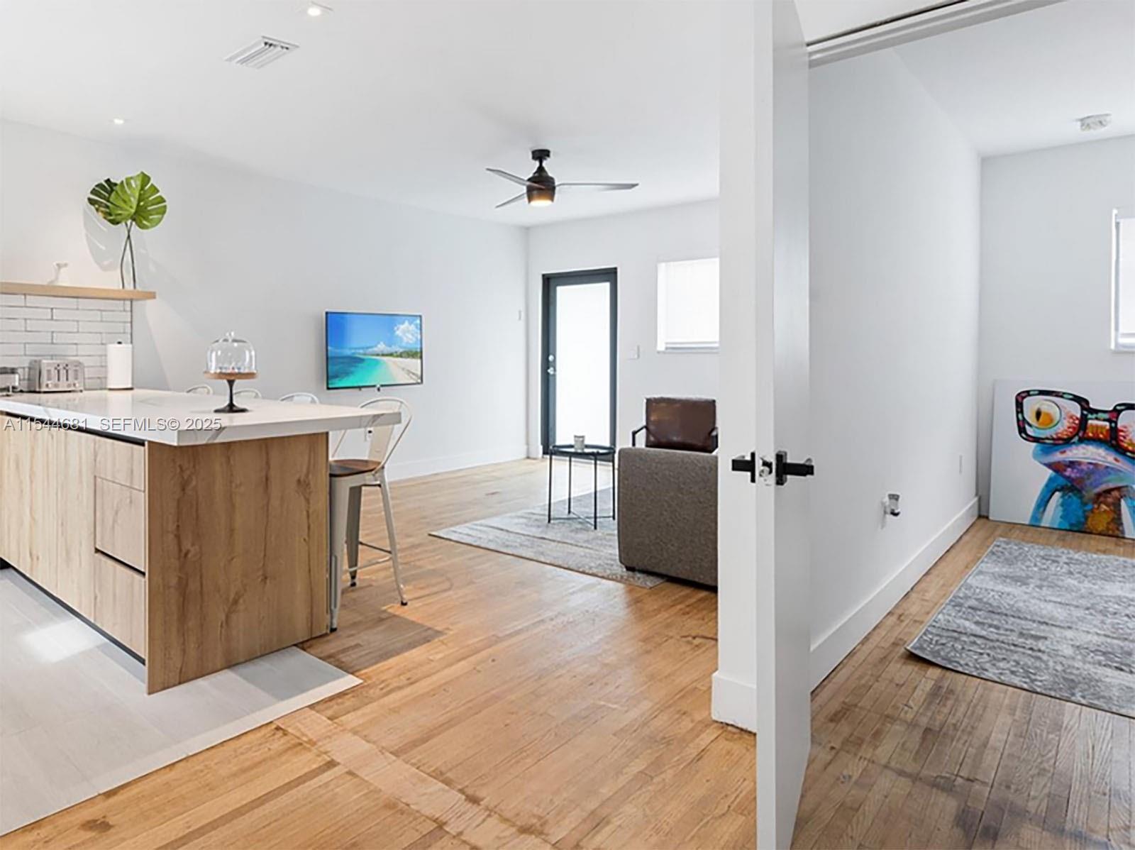 740 Southwest 9th Street, Unit 1 Miami, FL 33130 - Photo 9 of 34 a view of a room with cabinet and mirror