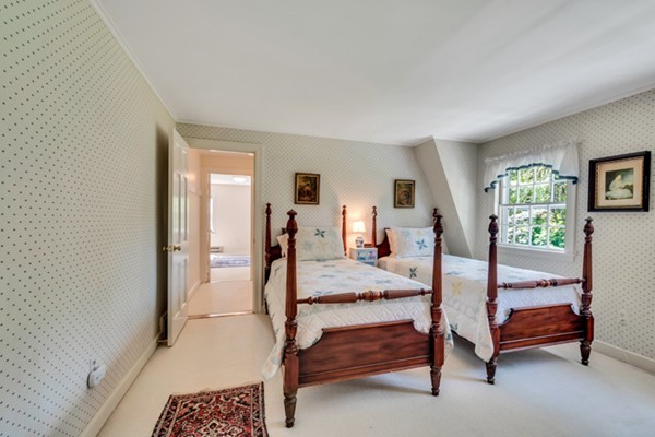 120 Cliff Road Wellesley, MA 02481 - Photo 18 of 25 a bedroom with a bed and wooden floor