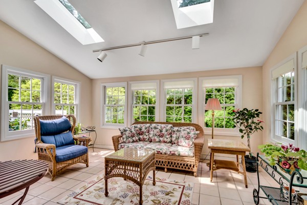120 Cliff Road Wellesley, MA 02481 - Photo 6 of 25 a living room with furniture and a potted plant