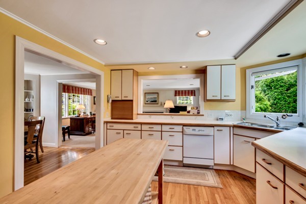 120 Cliff Road Wellesley, MA 02481 - Photo 9 of 25 a kitchen with a sink cabinets and wooden floor