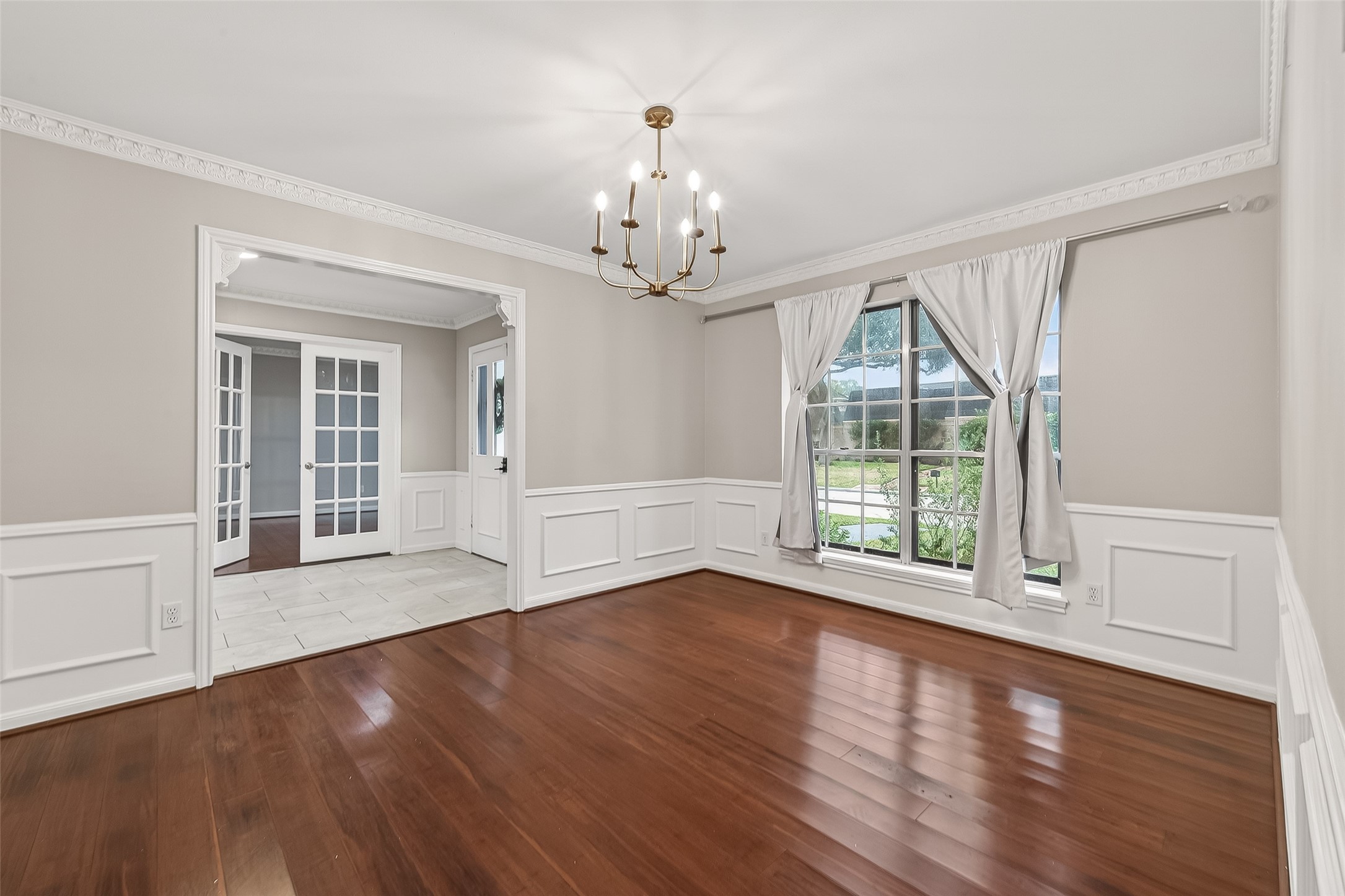 707 Montclair Boulevard Sugar Land, TX 77478 - Photo 19 of 50 a view of an empty room with wooden floor and a window