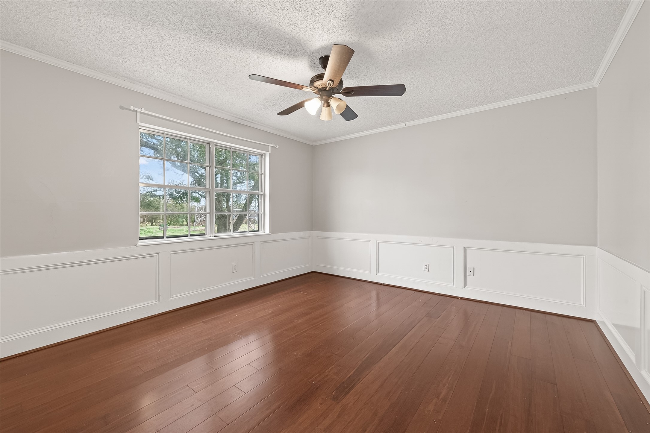 707 Montclair Boulevard Sugar Land, TX 77478 - Photo 29 of 50 an empty room with wooden floor chandelier fan and windows