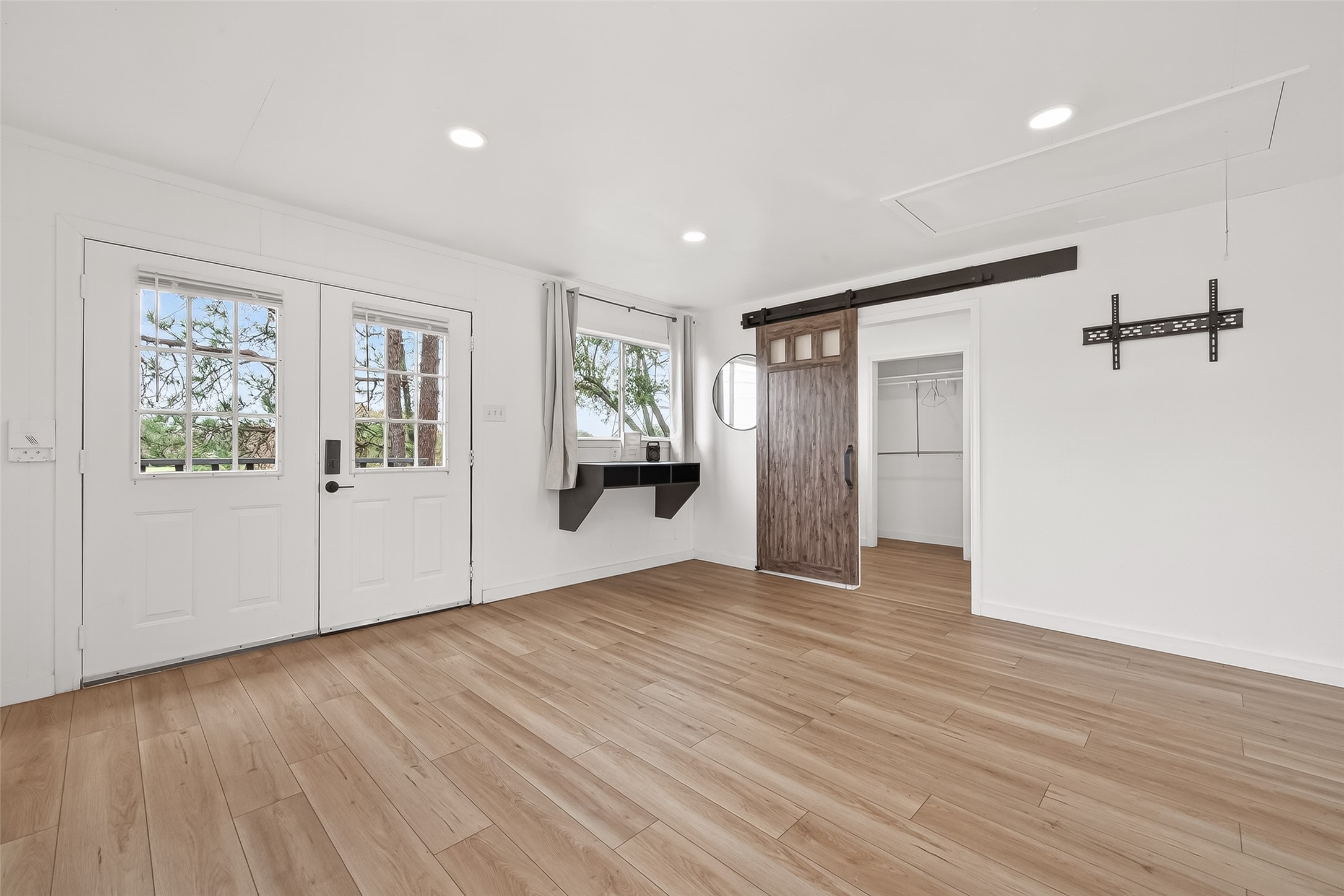 707 Montclair Boulevard Sugar Land, TX 77478 - Photo 33 of 50 a view of an empty room with window and wooden floor
