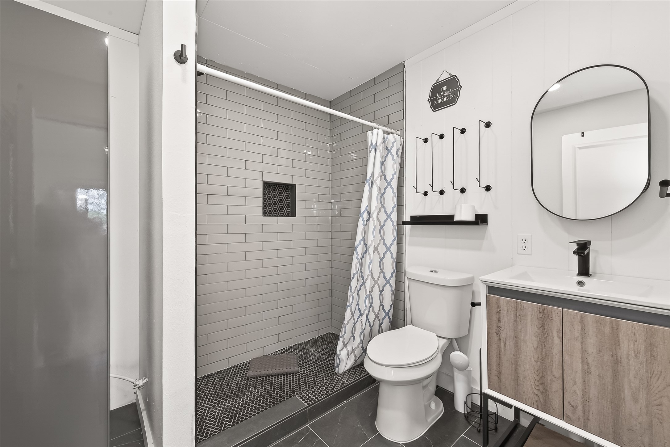 707 Montclair Boulevard Sugar Land, TX 77478 - Photo 34 of 50 a bathroom with a toilet a sink and mirror