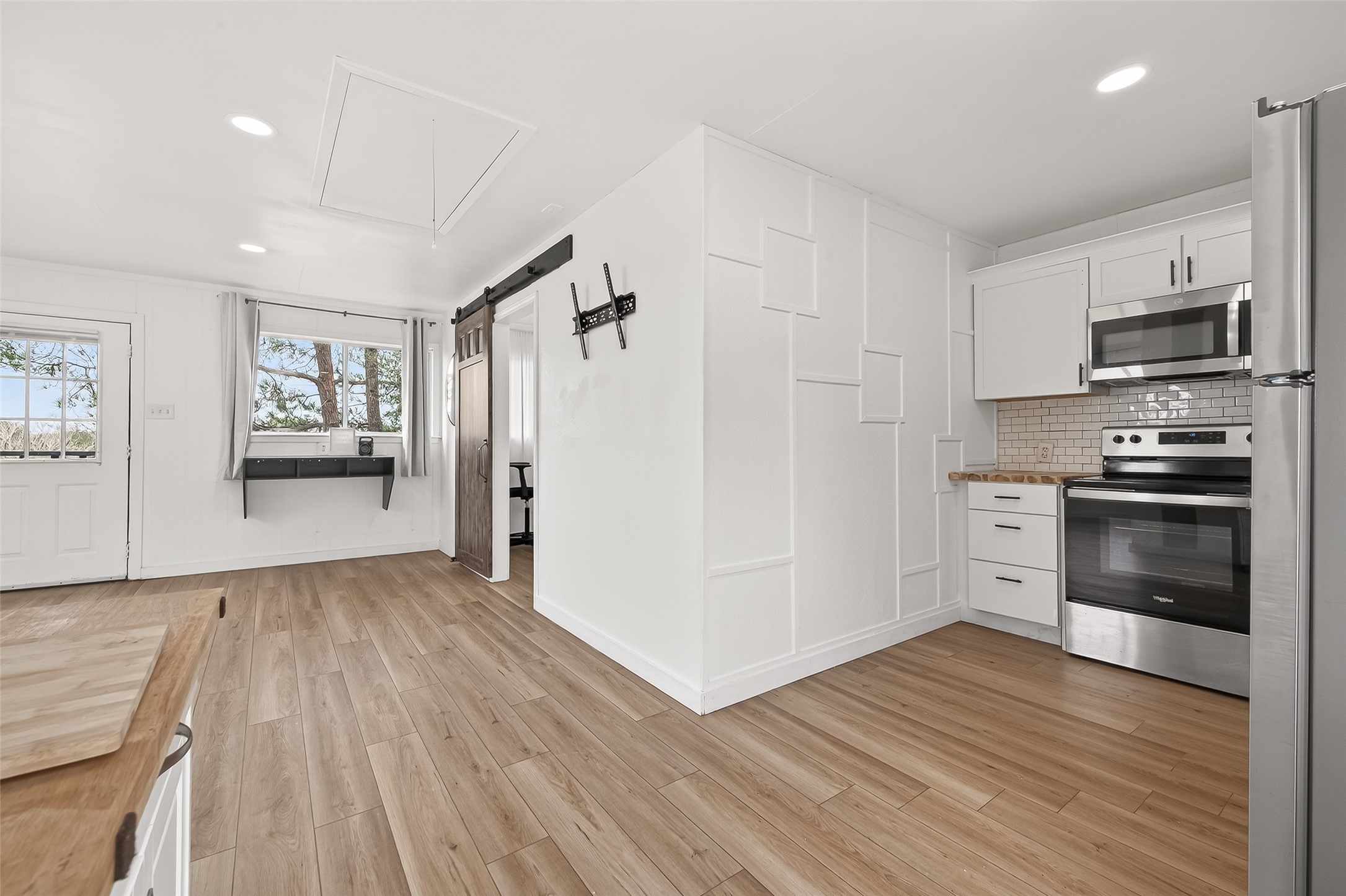 707 Montclair Boulevard Sugar Land, TX 77478 - Photo 35 of 50 a view of kitchen with wooden floor electronic appliances and window