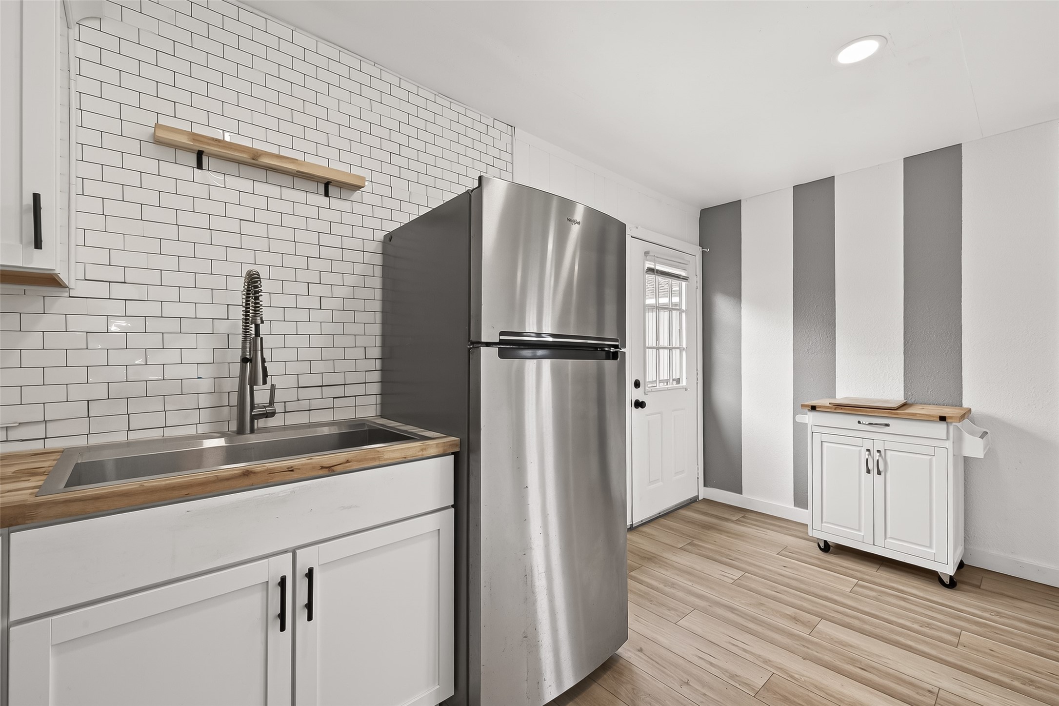 707 Montclair Boulevard Sugar Land, TX 77478 - Photo 38 of 50 a kitchen with stainless steel appliances granite countertop a refrigerator and a sink