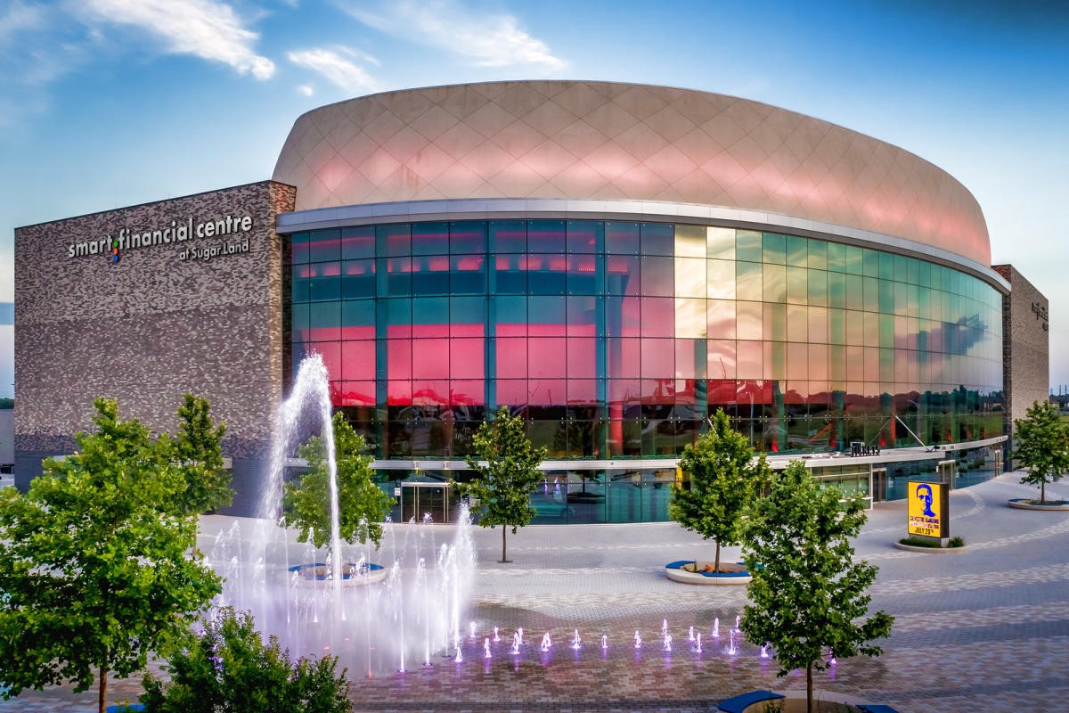 707 Montclair Boulevard Sugar Land, TX 77478 - Photo 49 of 50 a man sitting on a bench in front of a building