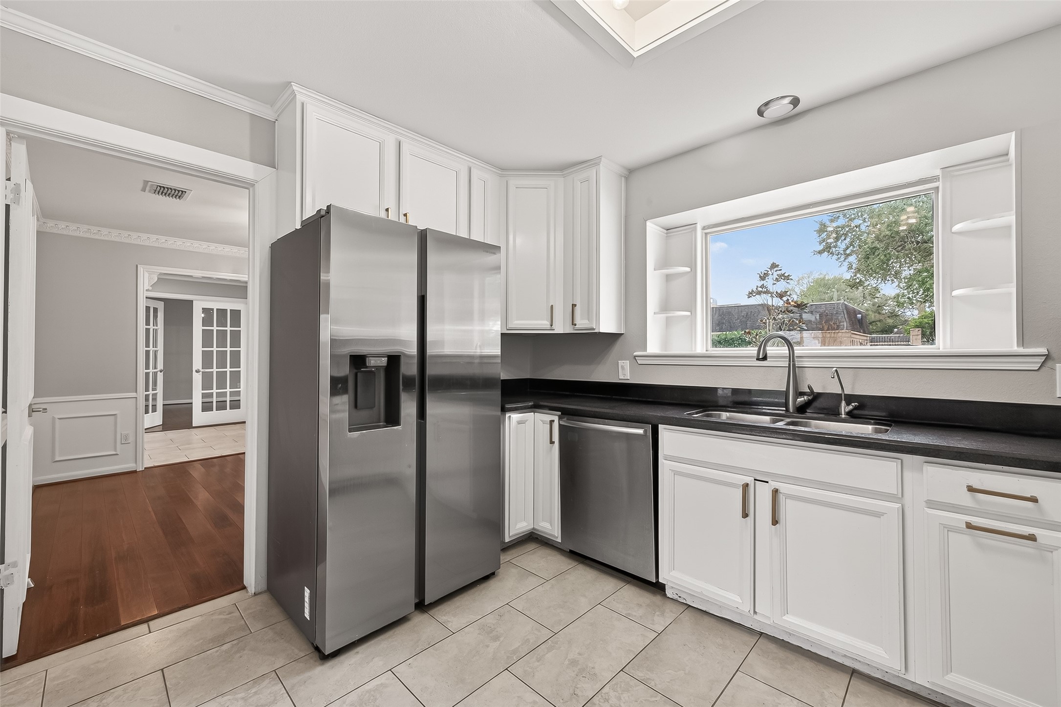 707 Montclair Boulevard Sugar Land, TX 77478 - Photo 10 of 50 a kitchen with granite countertop a refrigerator and a sink